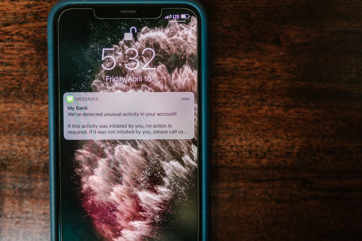 Smartphone screen showing a bank fraud alert notification